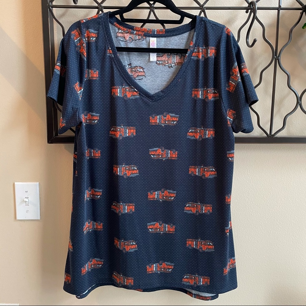 Lularoe vneck Christy top with Firetruck pattern 🚒. Navy blue, EUC. Size XL